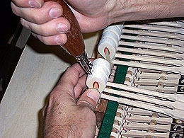 Voicing a grand piano hammer